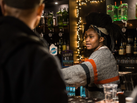 Person pouring coffee from jug into cup. But the jug has been dropped and is falling. Disaster is imminent.