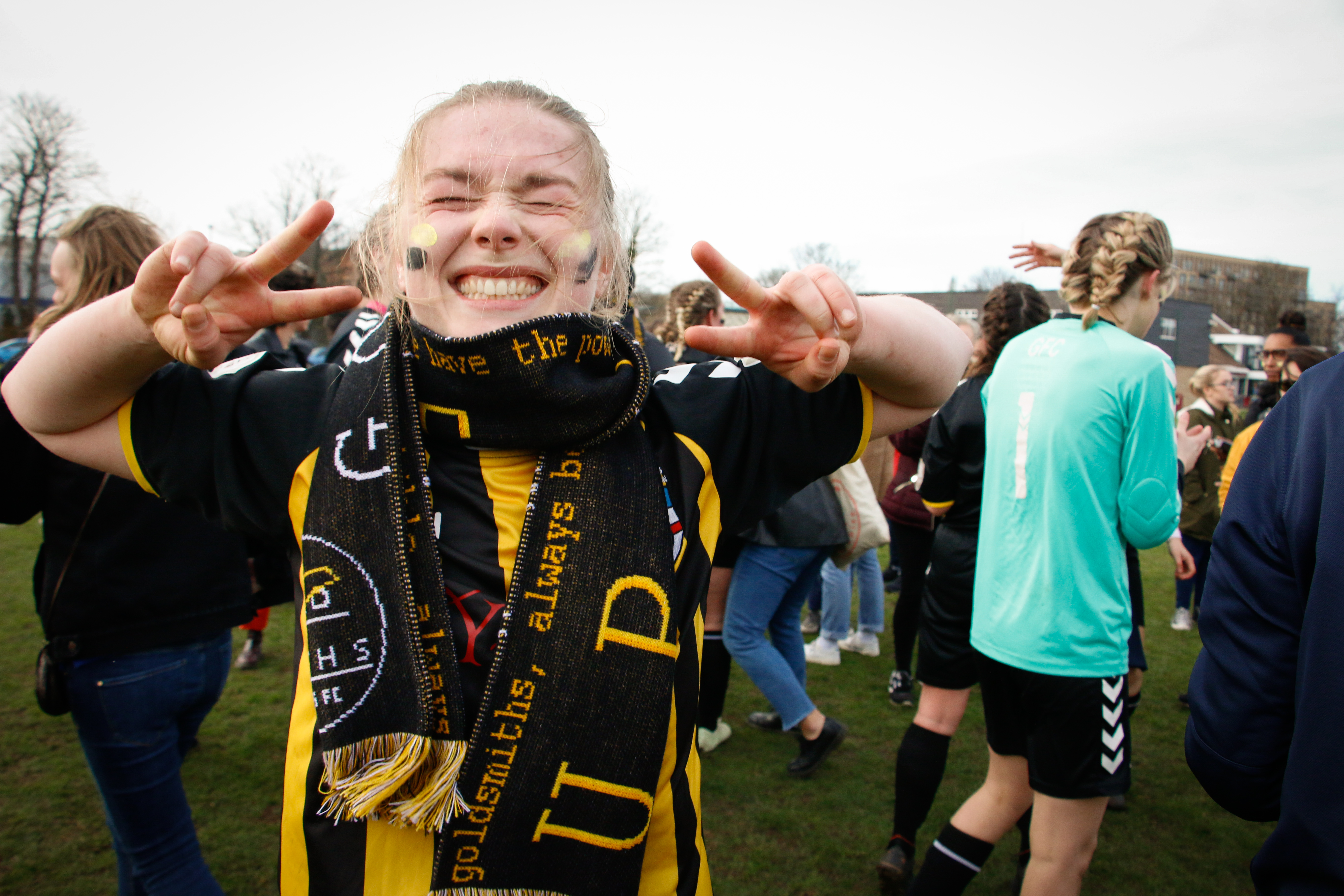 Photograph of student in branded clothing, celebrating
