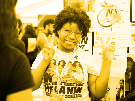 The word 'Society' repeated over a red-tinted photograph of a student